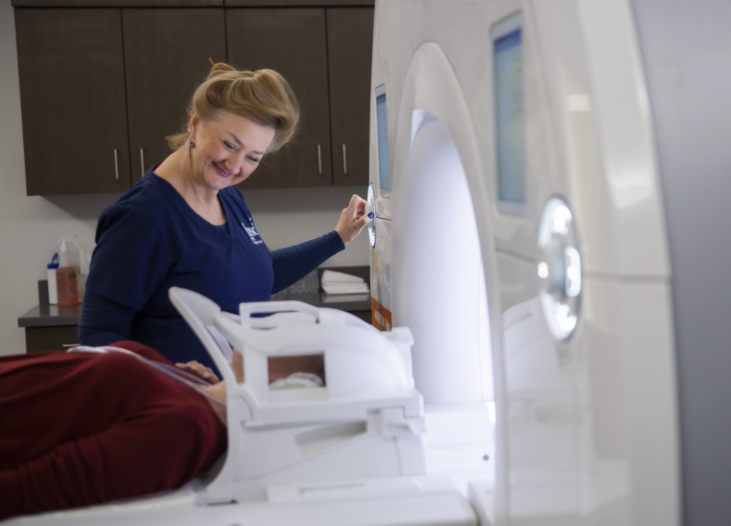 Tanya Blythe, operating an MRI machine